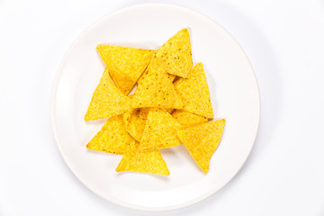 Crispy nachos on a plate isolated on white background