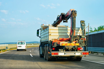 Truck with crane on highway road Slovenia