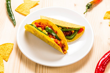 Stuffed colorful burritos on a wooden background