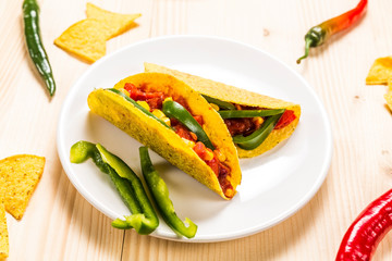 Stuffed colorful burritos on a wooden background