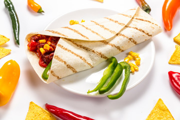 Stuffed colorful tortilla on a white background