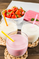 Colorful milkshakes on a wooden table