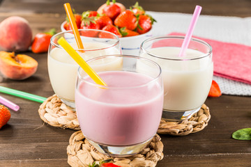 Colorful milkshakes on a wooden table