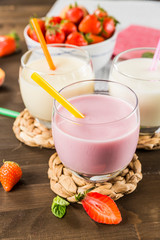 Colorful milkshakes on a wooden table