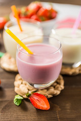 Colorful milkshakes on a wooden table