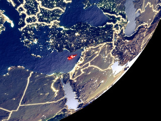 Cyprus from space on model of Earth at night. Very fine detail of the plastic planet surface and visible bright city lights.