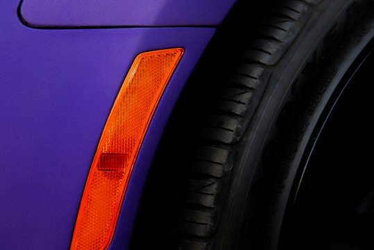 Cropped image of purple car