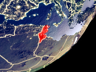Tunisia from space on model of Earth at night. Very fine detail of the plastic planet surface and visible bright city lights.