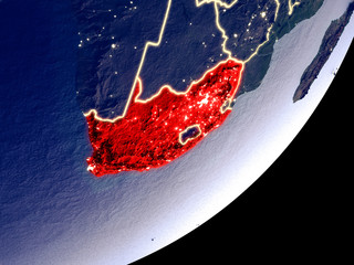 South Africa from space on model of Earth at night. Very fine detail of the plastic planet surface and visible bright city lights.