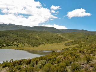 Fototapeta na wymiar Lake against a mountain background, Lake Ellis, Mount Kenya National Park, Kenya
