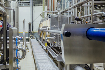 Modern brewery interior. Equipment of beer production line