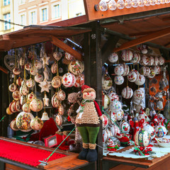 Beautiful multi-colored Christmas balls and toys for decorating house at Christmas Market. Xmas market in Europe on holidays