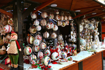 Beautiful multi-colored Christmas balls and toys for decorating house at Christmas Market. Xmas market in Europe on holidays