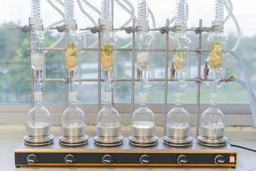 Soxhlet Extractor.Percolator-boiler and reflux,distillation flask on heating element.