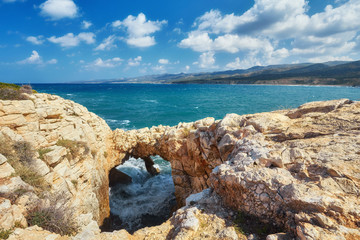Big waves break about the Rocky Peninsula of Cape Lara in southern Akamas