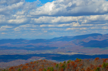 Naklejka premium autumn landscape with mountains and blue sky