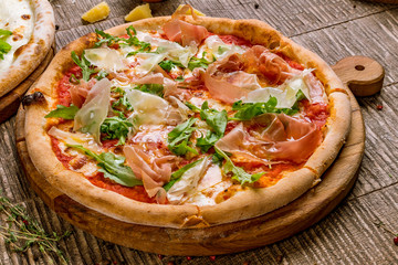 Pizza with Parma ham and arugula