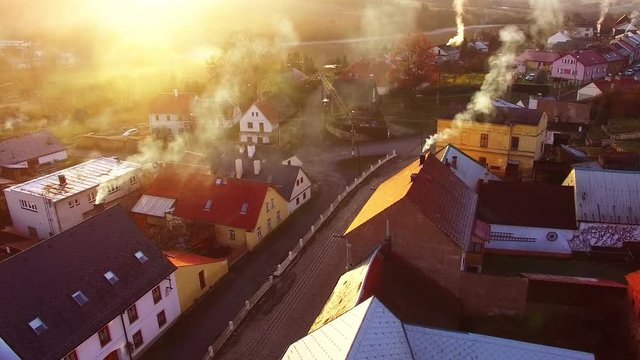 Camera flight over a Czech village in winter. Local heating is important source of emissions. Air pollution and climate change theme. Sustainable development and ecology in European Union.