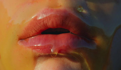 Honey. Sweet, sexy lips, temptation concept. Sweet taste on the female body, face mouth closeup....