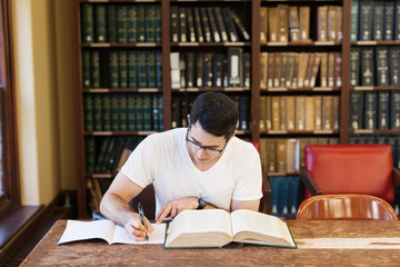 Young student studying in library