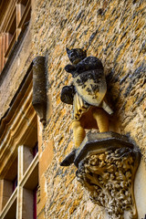Sculpture on the facade of the Chateau de Puymartin in the Dordogne region of France 