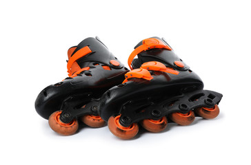 Pair of inline roller skates on white background