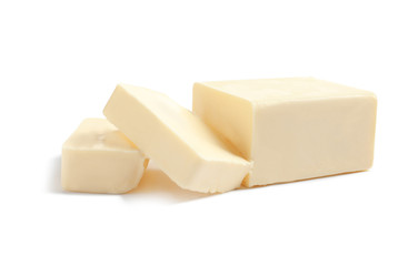 Cut block of fresh butter on white background