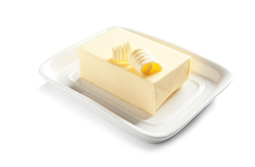 Ceramic dish with block of fresh butter on white background