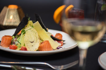 Caesar salad with salmon fish. Tasty restaurant dish