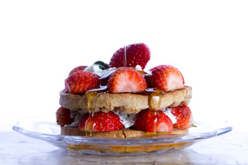 strawberries pancakes  and cream