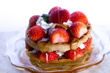 strawberries pancakes  and cream