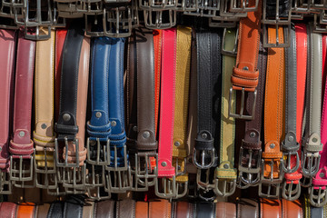 Colorful leather belts at street market