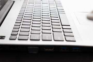 Black office desk with laptop keyboard