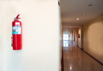 Fire extinguisher install front of the room.Security system concept.