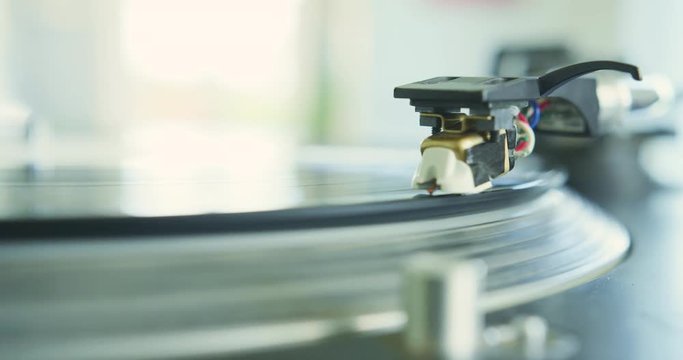 Closeup Of Hand Placing Stylus Needle On Record Player 4K
