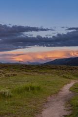 Trail Leads Into Field and Sunset