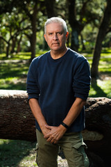 Handsome man outdoors in a park setting