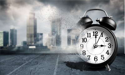 Vintage black alarm clock isolated on white background