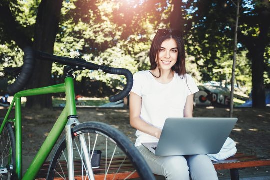 Girl Working With Laptop On Beanch