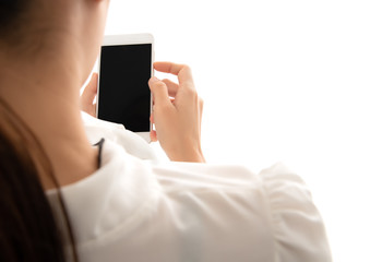 Close up hand of  asian woman holding the blank screen of mobile phone isolated on white background.