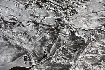 The morning frost has created from water an ice plate with a freakish pattern.