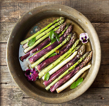 Overhead view of asparagus in copper basin