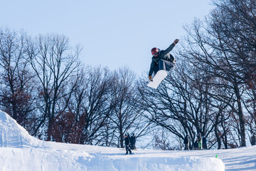 People are enjoying half-pipe skiing	/ snowboarding	
