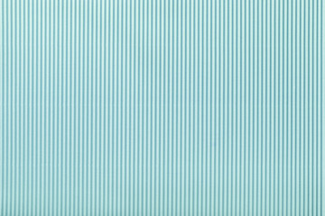 Texture of corrugated light blue paper, macro.