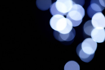 Abstract blue bokeh on dark background, Christmas blurred background
