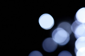 Abstract blue bokeh on dark background, Christmas blurred background