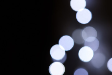 Abstract blue bokeh on dark background, Christmas blurred background