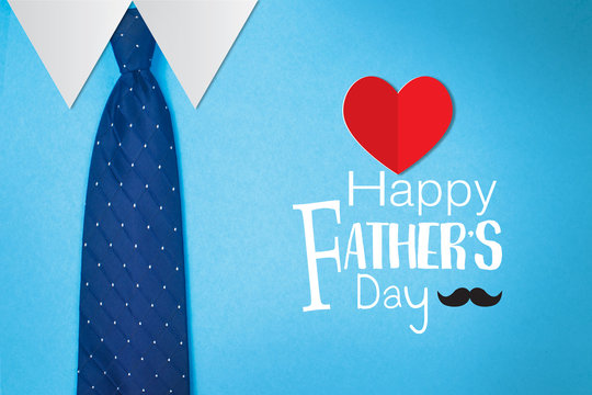 Happy Father's Day Text With  Tie On Blue Paper Background