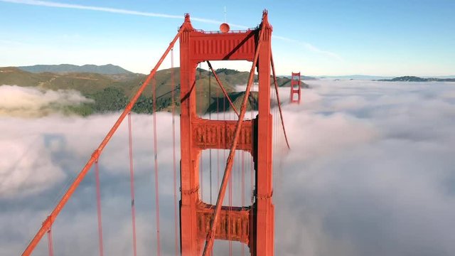 San Francisco Golden Gate Bridge Sticking / Poking Through Thick blanket of Fog - Aerial View / Flyover From Helicopter