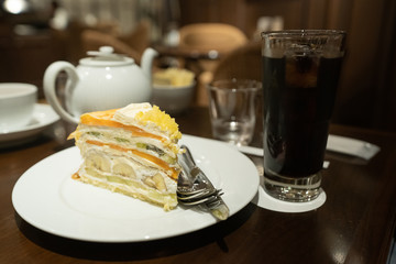 cup of tea and cake on wooden table